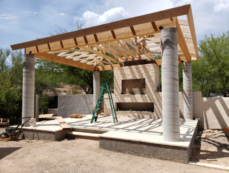 Pergola build in progress with stone columns