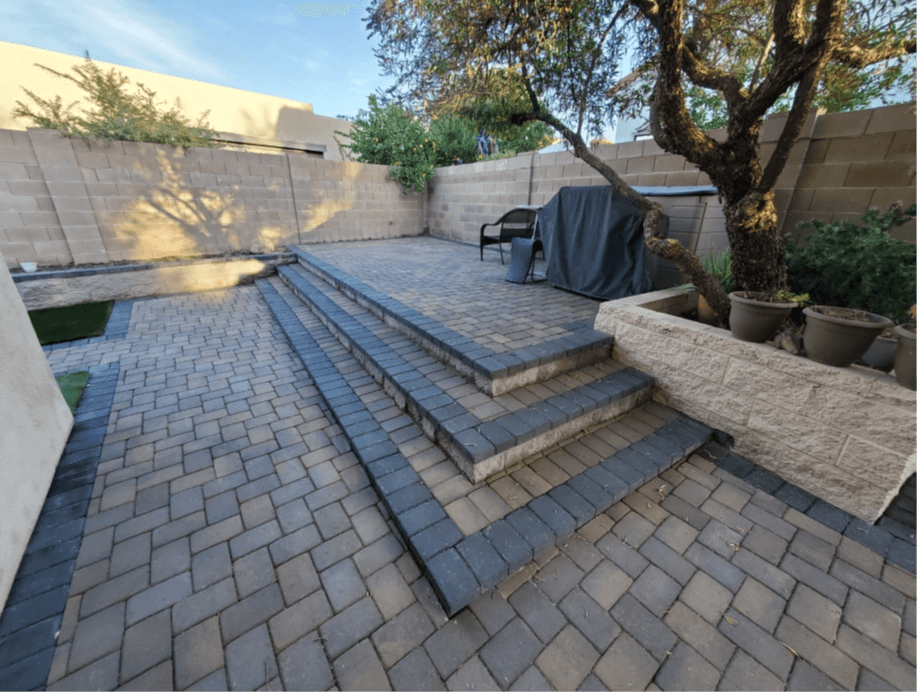 Paver patio with steps and retaining wall